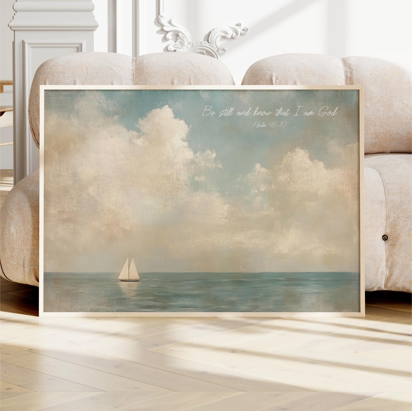 a framed painting of a sailboat on the ocean, with a serene and peaceful atmosphere.