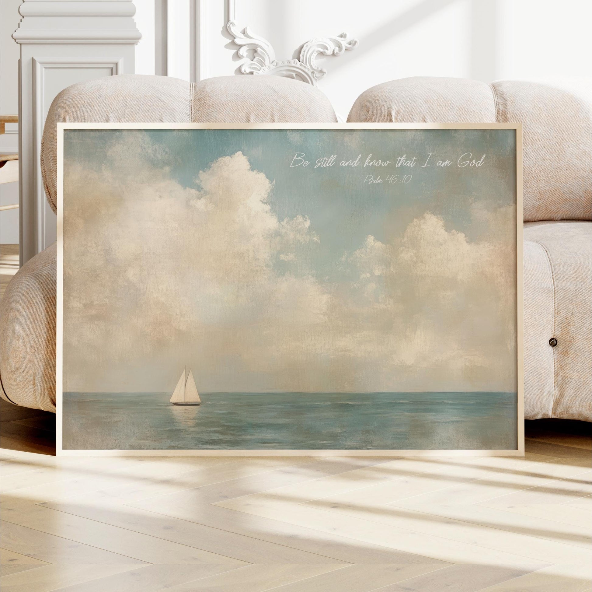 a framed painting of a sailboat on the ocean, with a serene and peaceful atmosphere.