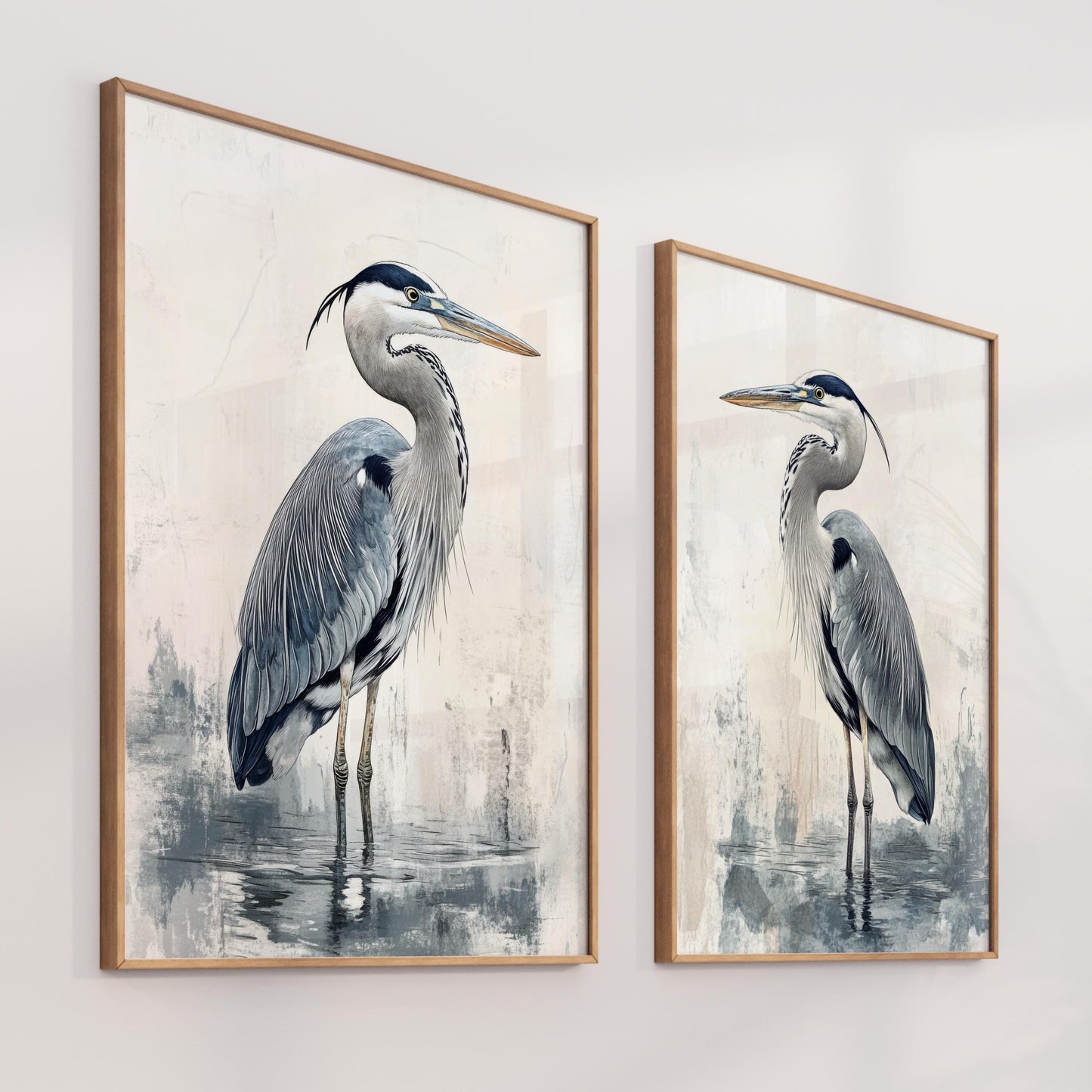 two paintings of birds are hanging on a wall