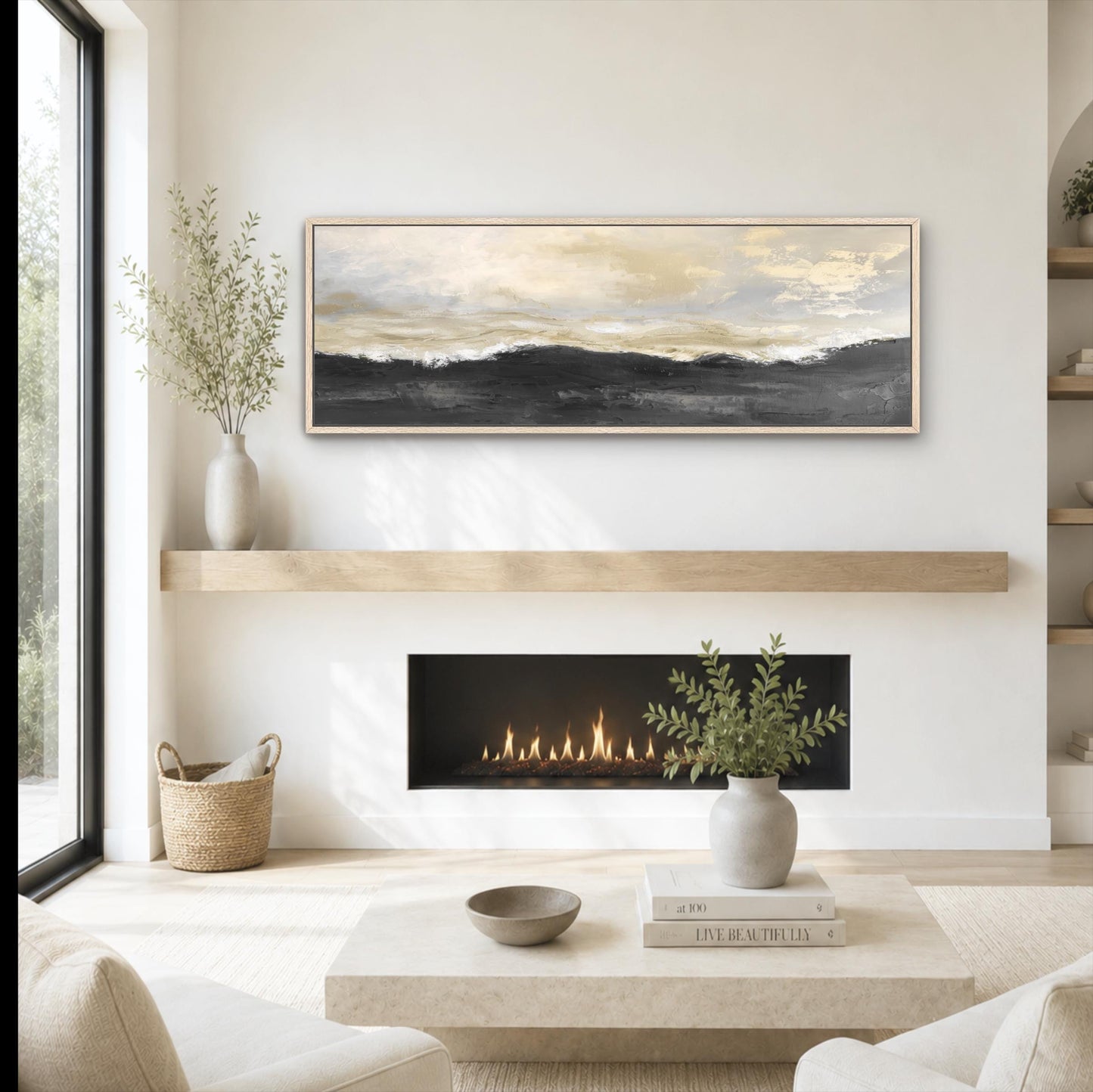 a cozy living room with a fireplace, a coffee table, and a painting on the wall. The room has a minimalist and modern design, with a neutral color palette and natural elements like plants and a woven basket.