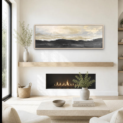 a cozy living room with a fireplace, a coffee table, and a painting on the wall. The room has a minimalist and modern design, with a neutral color palette and natural elements like plants and a woven basket.