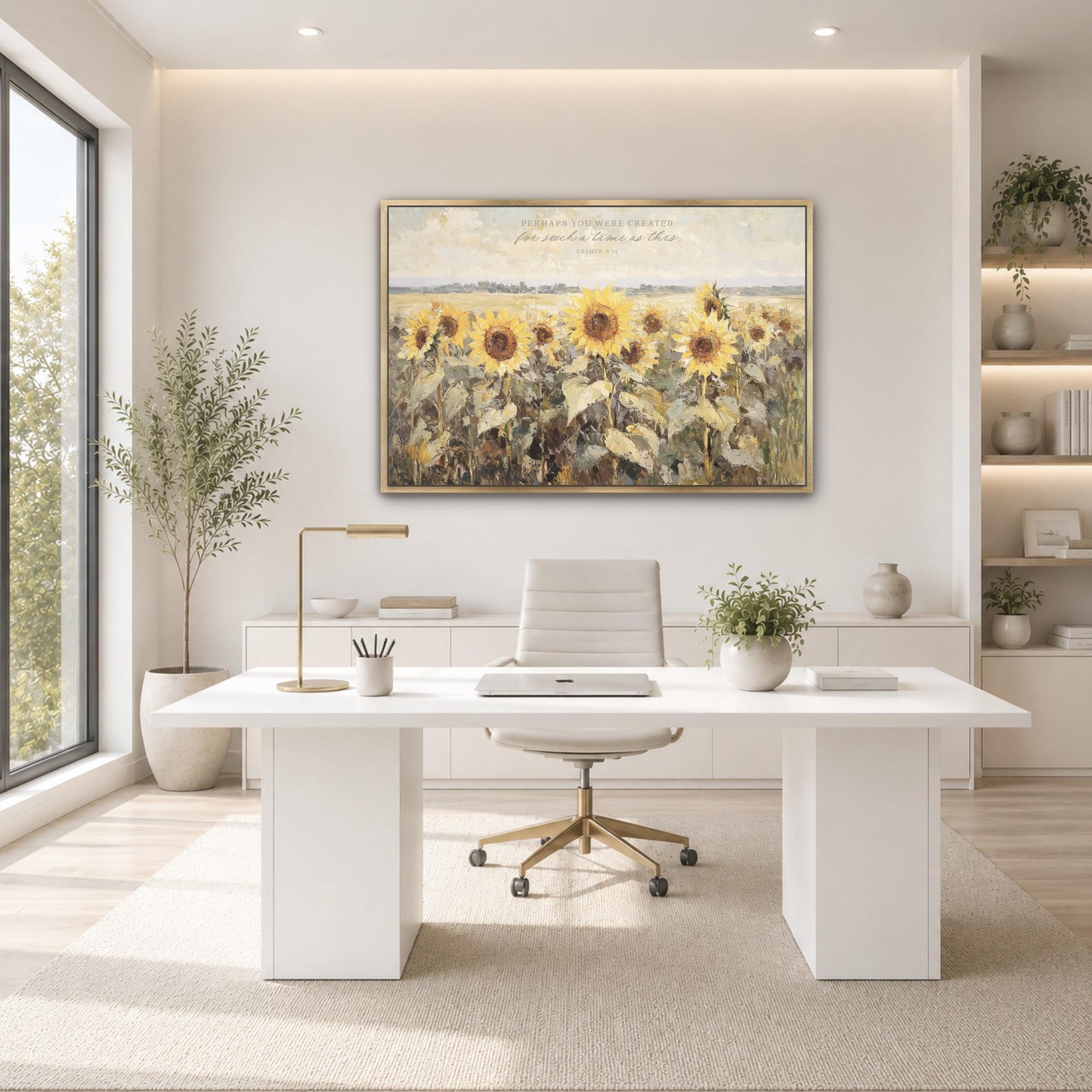 A modern, minimalist office space with a large painting of sunflowers on the wall, a white desk with a computer, and a comfortable-looking chair.
