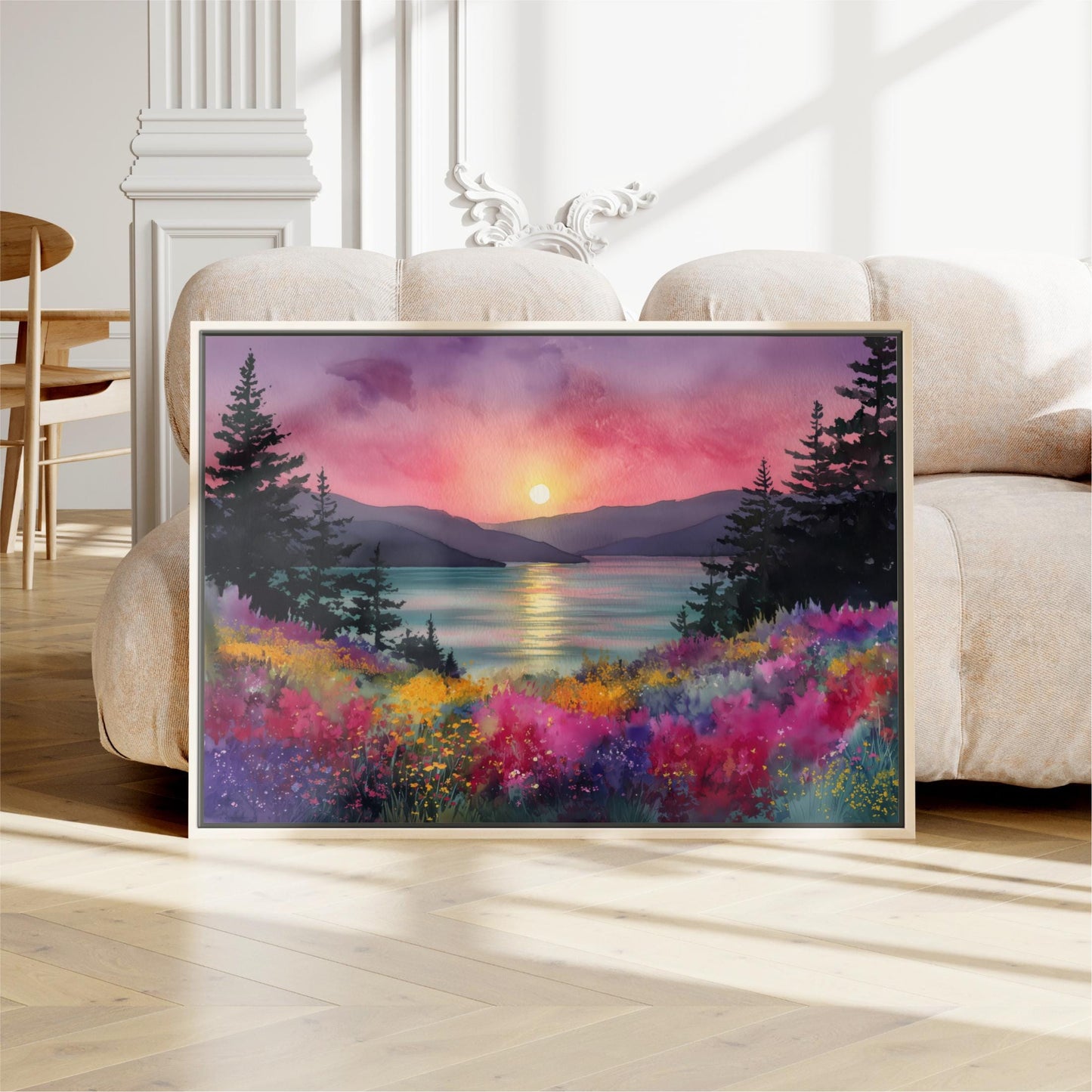 a large, framed painting depicting a serene landscape with a sunset over a body of water, surrounded by trees and colorful flowers.