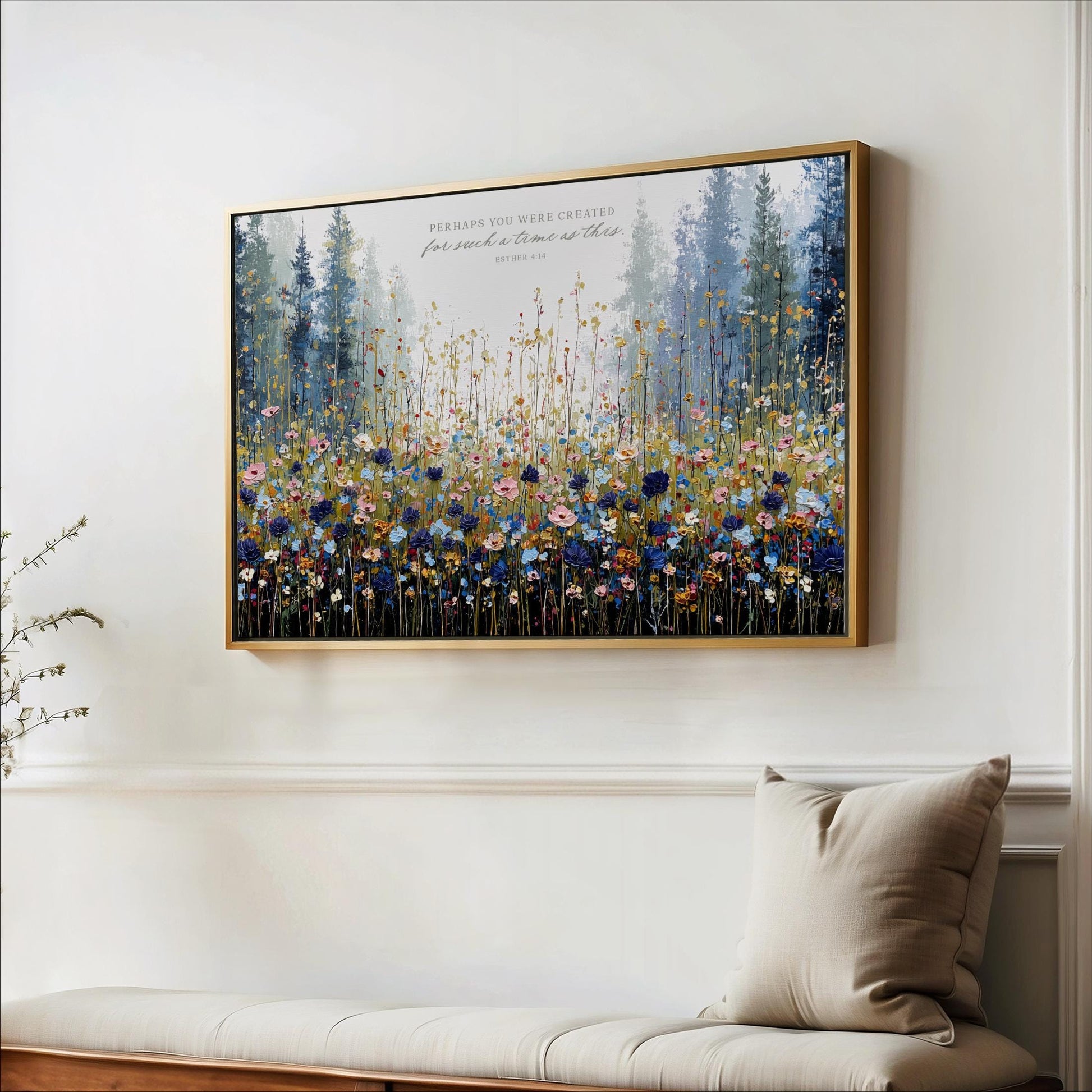 a large framed painting of a field of flowers hanging on a wall.