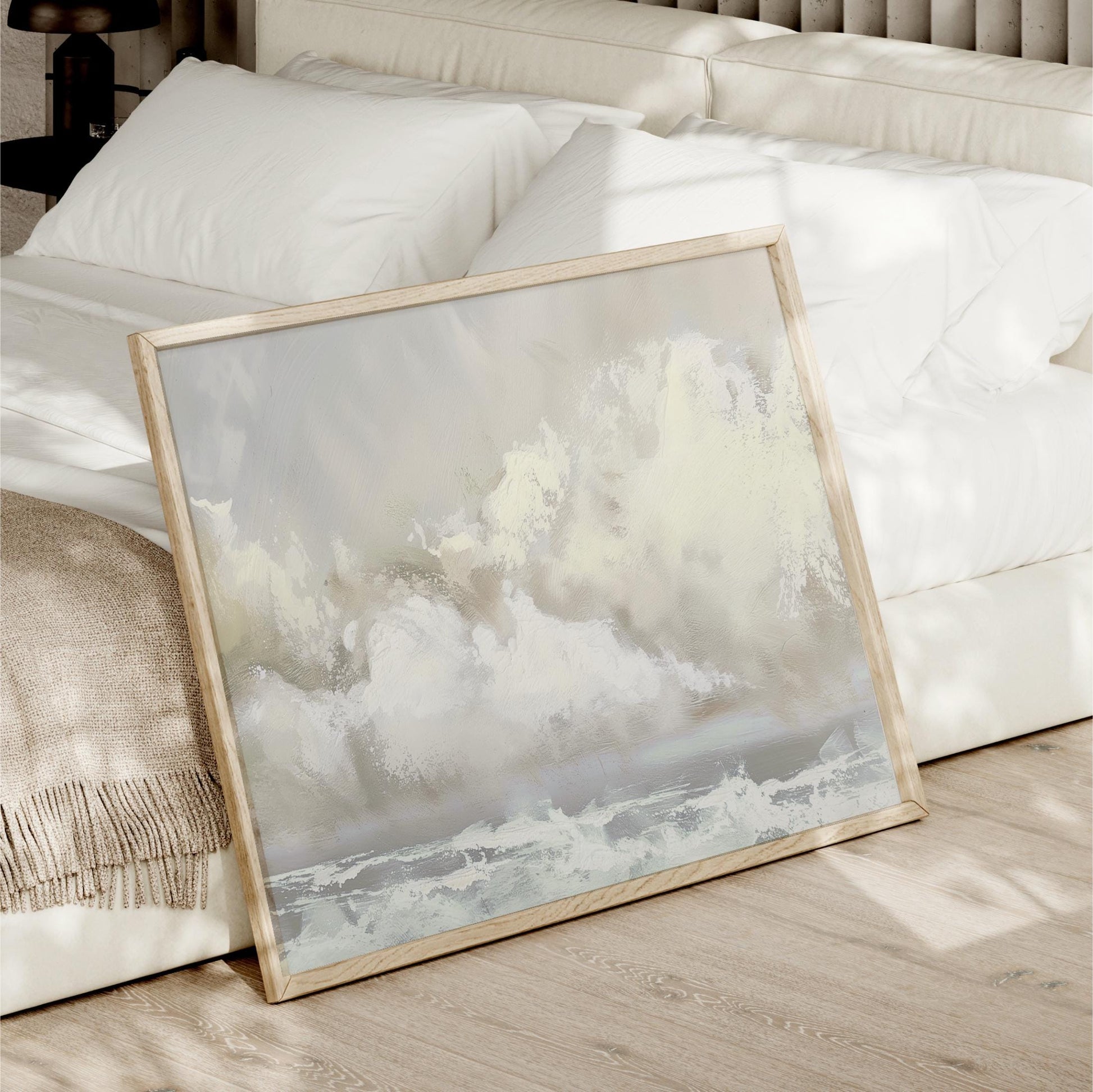 a picture frame sitting on the floor next to a bed