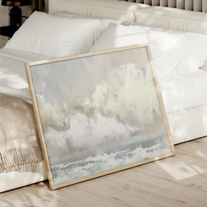 a picture frame sitting on the floor next to a bed