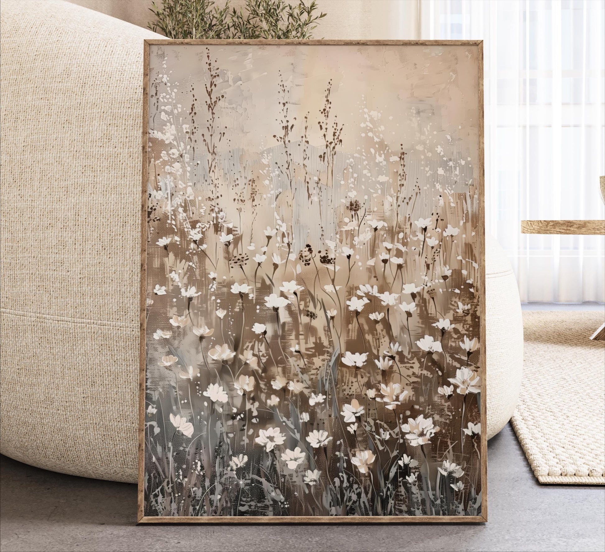a large framed painting of a field of flowers, with a mix of white and brown flowers, set against a neutral background.