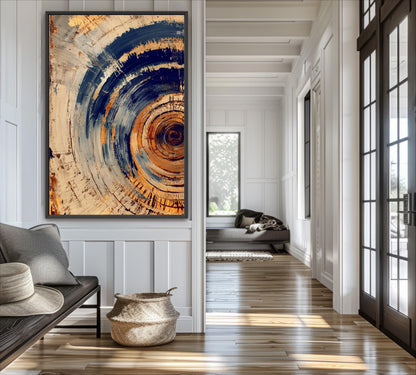 a modern and minimalist interior design with a large abstract painting on the wall, a sofa, a basket, and a wooden floor.