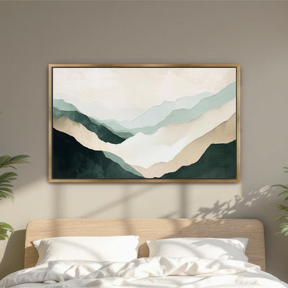 a large, abstract painting of mountains hanging on a wall above a bed with white pillows.