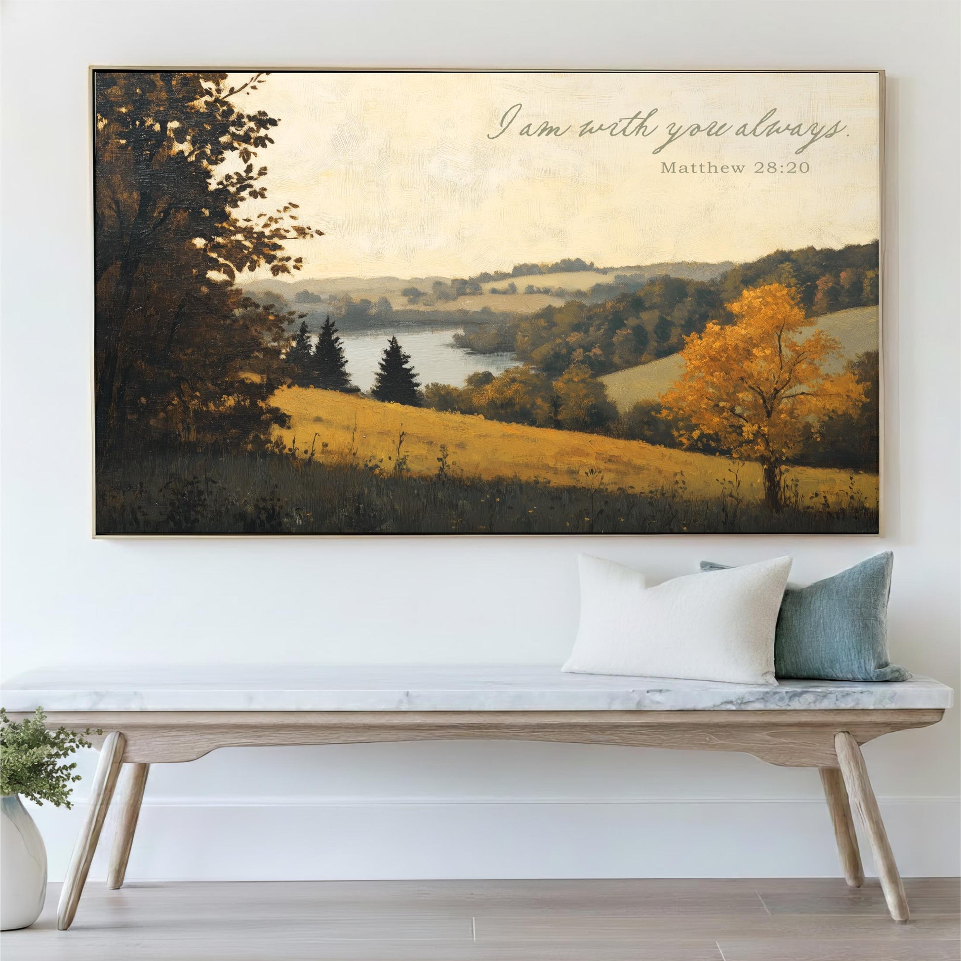a large landscape painting hanging on a wall above a wooden bench with pillows.