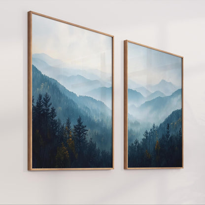 two framed landscape paintings depicting a serene mountain scene with trees and fog.