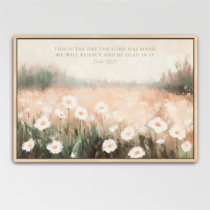 The image is a framed painting depicting a field of white flowers against a blurred background, with a text overlay that reads "This is the day the LORD has made; we will rejoice and be Glad in it."