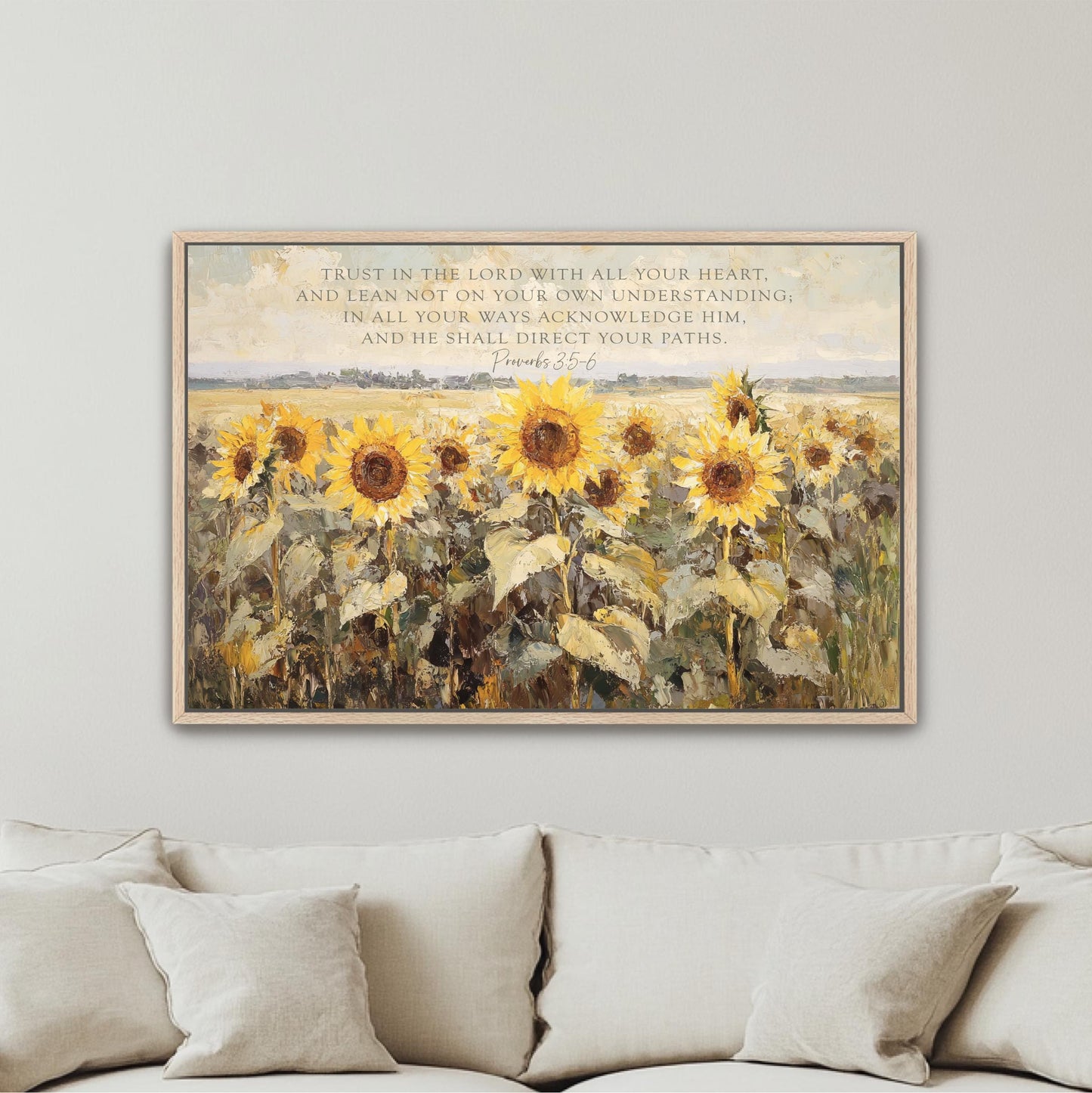 a living room with a couch and a painting on the wall