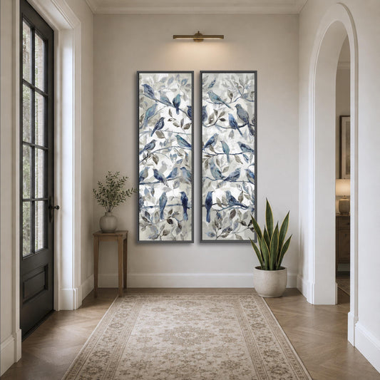 a hallway with a large painting of blue birds on the wall, a small table with a plant, and a rug on the floor.