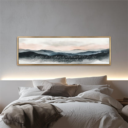 a large, framed painting of a serene landscape with mountains and a cloudy sky above a bed with white bedding and pillows.