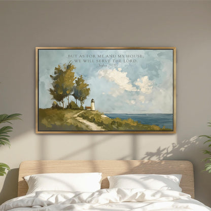 A framed painting of a lighthouse on a hill overlooking the ocean, with a quote from the Bible above it, is displayed on a wall above a bed.