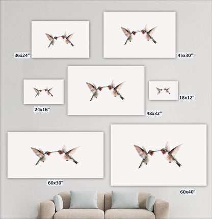 a collection of seven framed artworks featuring two hummingbirds in various sizes, arranged on a wall above a couch.
