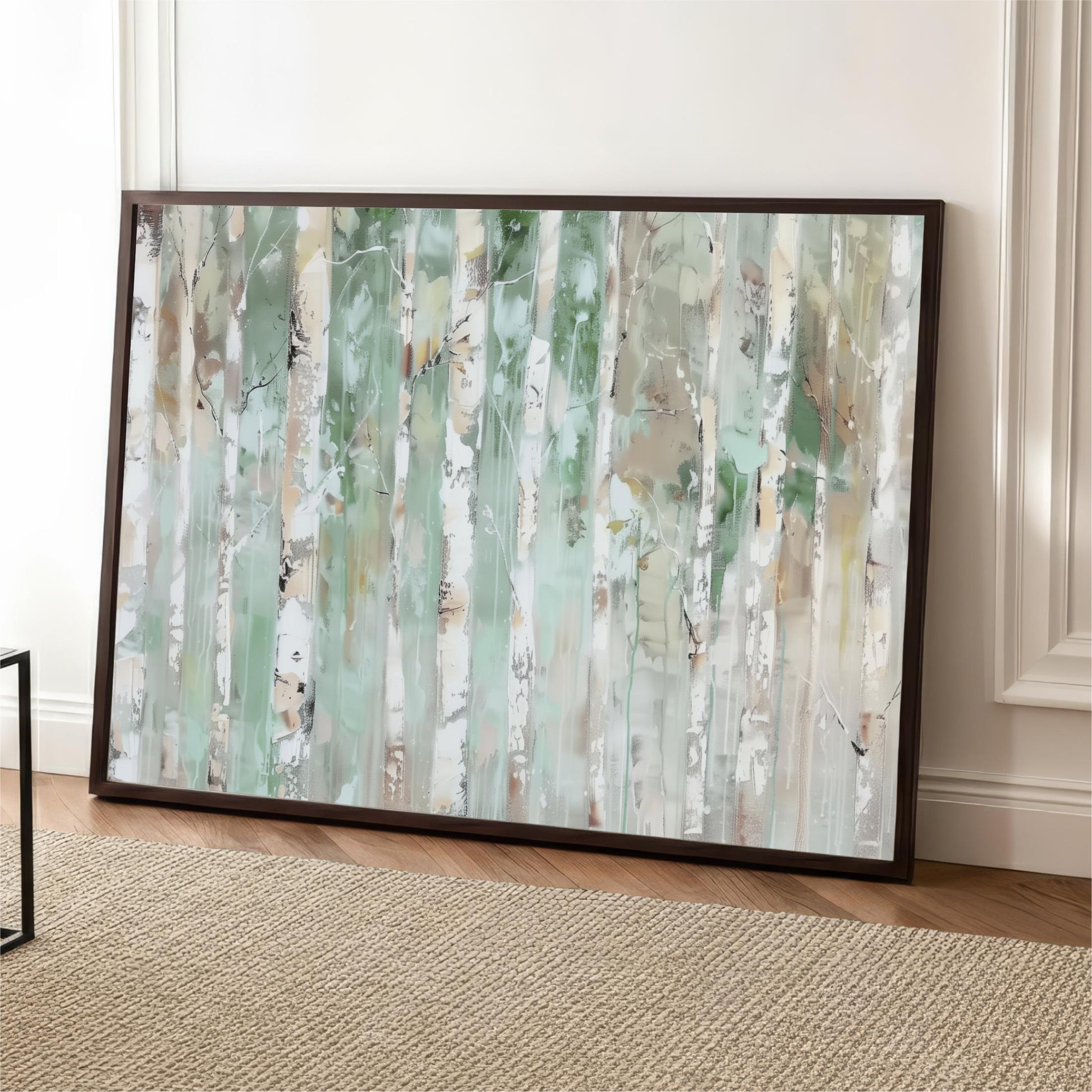 a large, framed painting of a forest scene with tall trees and a light green color scheme.