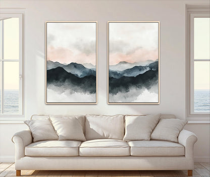 two large paintings hanging on a wall above a white sofa in a living room.