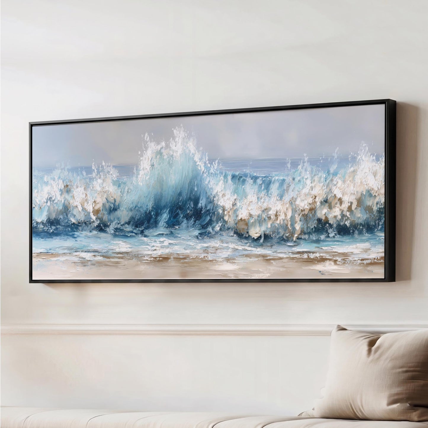 a large framed painting of a crashing wave, hanging on a wall above a couch.