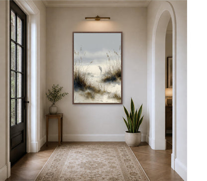 a serene indoor setting with a large painting of a beach scene hanging on the wall, a wooden table with a plant, and a rug on the floor.