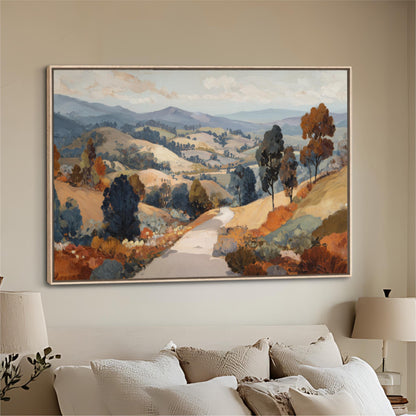 a large landscape painting hanging on a wall above a bed with white pillows.