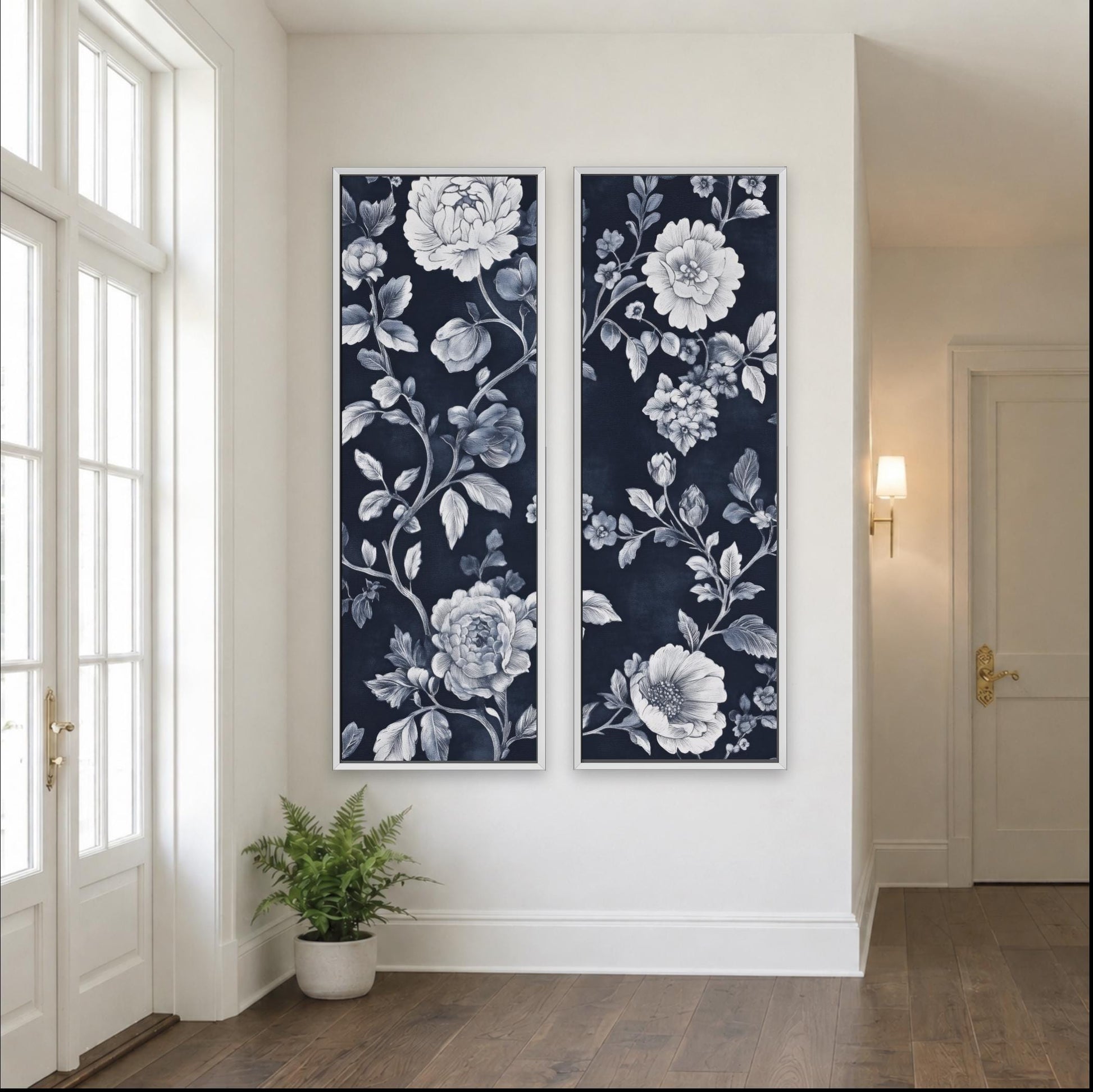 two large paintings hanging on a white wall, depicting a floral design in shades of blue and white. The paintings are positioned next to a door and a window, creating a balanced and harmonious composition in the room.