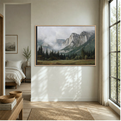 a large landscape painting hanging on a wall, depicting a mountainous scene with trees and a misty atmosphere.