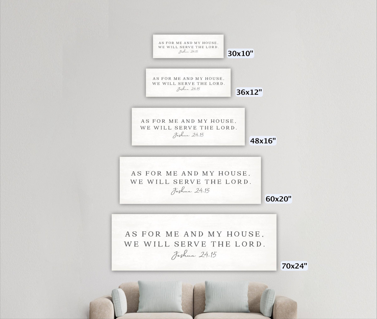 a series of four white rectangular signs with text, each varying in size, placed on a white wall.