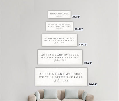 a series of four white rectangular signs with text, each varying in size, placed on a white wall.