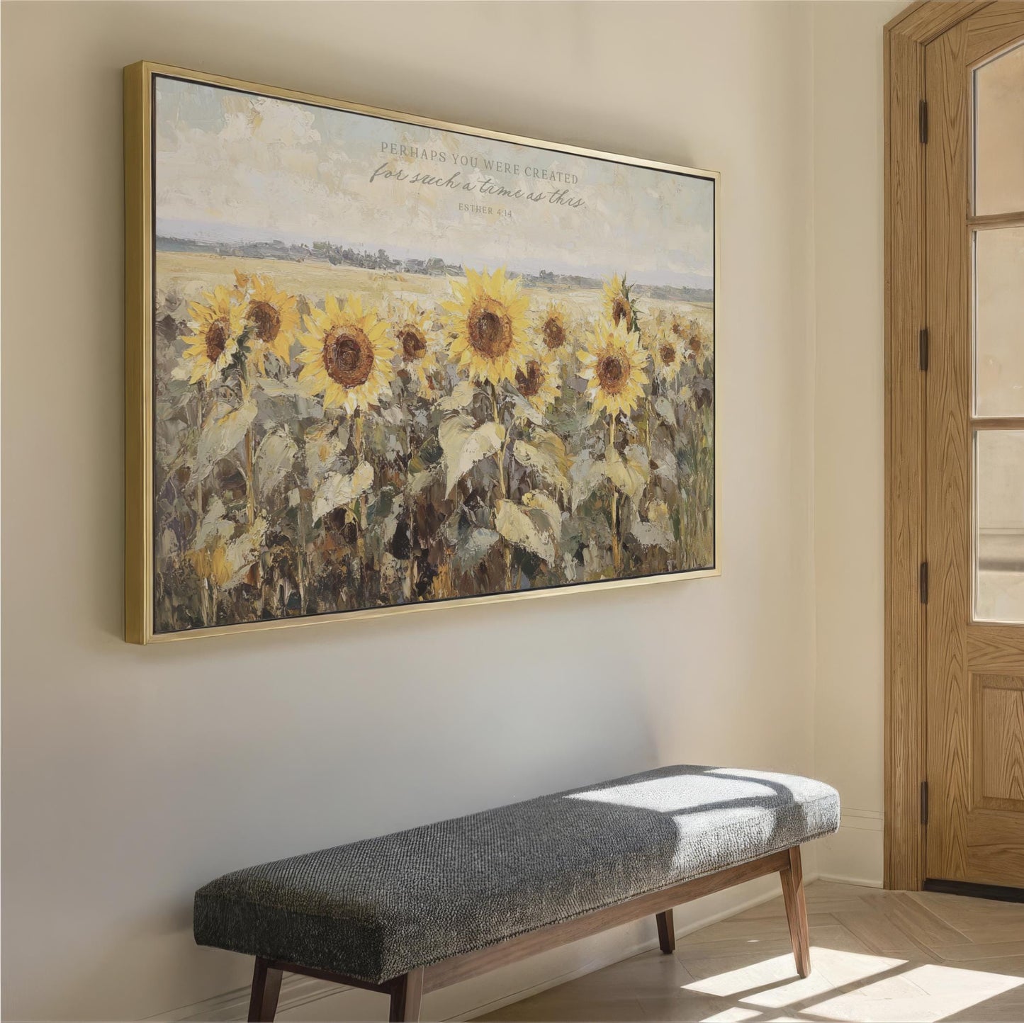 a large painting of a field of sunflowers hanging on a wall, with a bench in front of it.