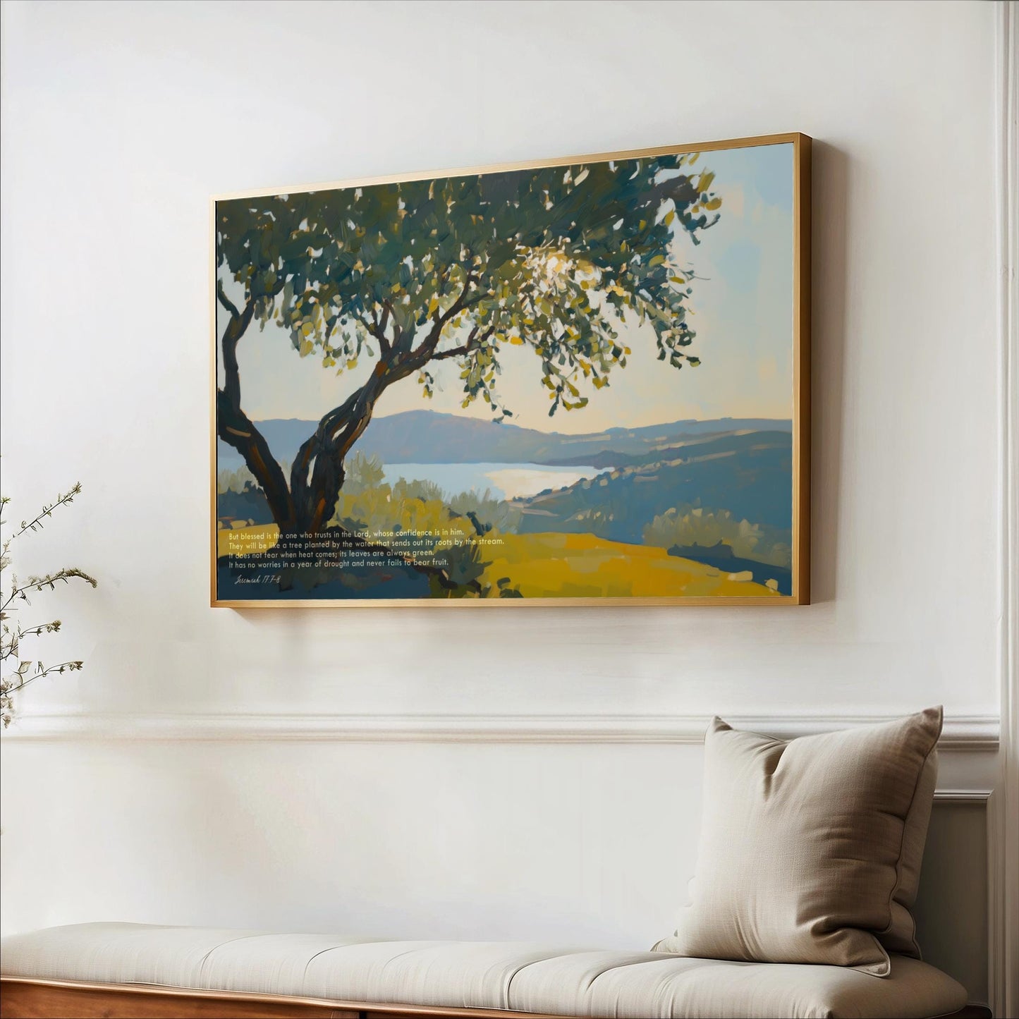 a large painting of a tree with a serene landscape in the background, hanging on a white wall above a wooden bench.
