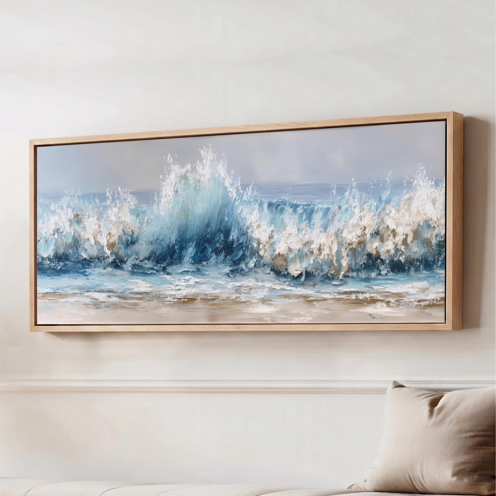 a large, framed painting of a crashing wave against a light blue sky.