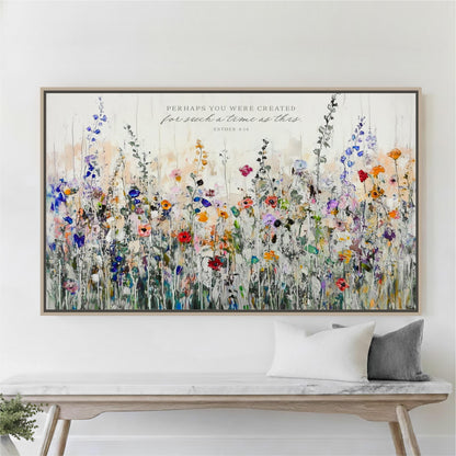 a large, colorful painting of a field of flowers hanging on a wall above a wooden bench.