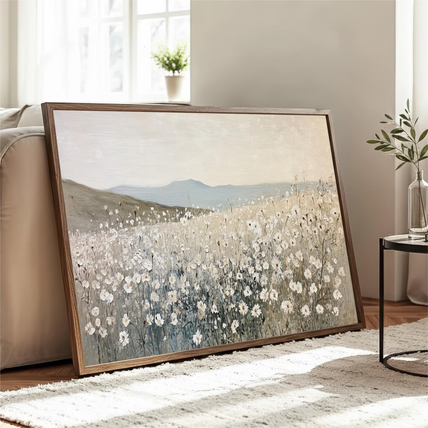 a large painting of a field of flowers, with a serene landscape in the background.