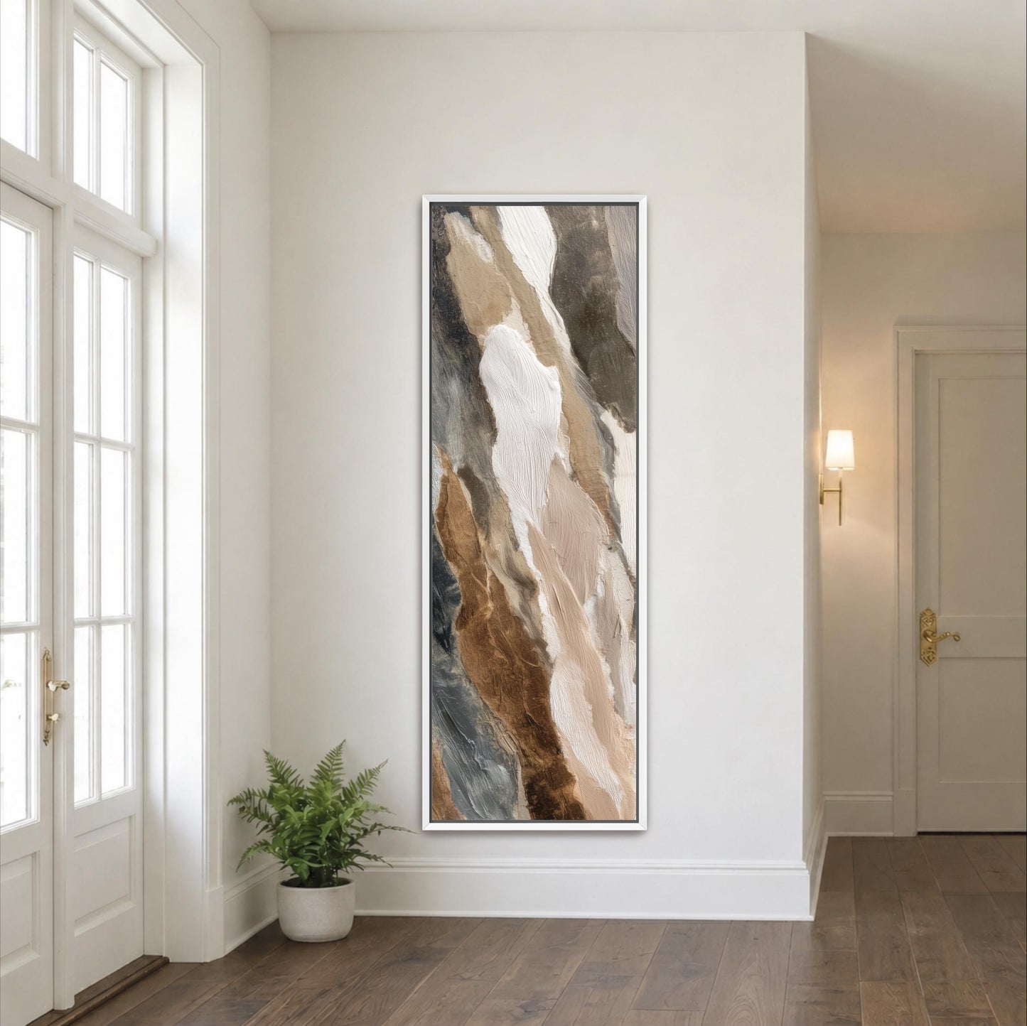 a large abstract painting hanging on a white wall in a room with a wooden floor.