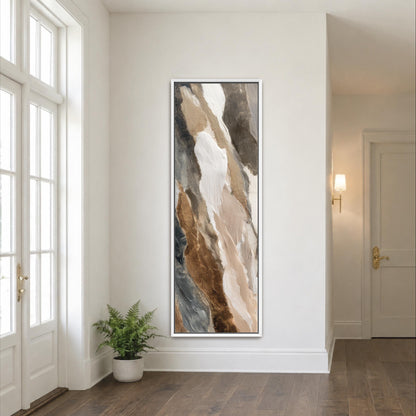 a large abstract painting hanging on a white wall in a room with a wooden floor.