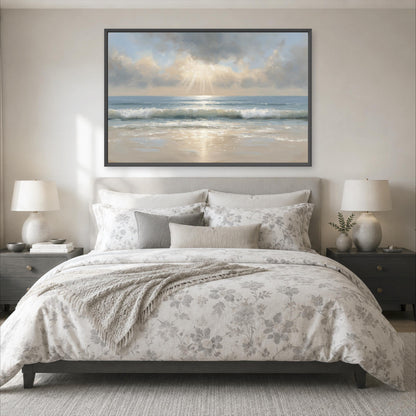 a serene bedroom scene with a large bed adorned with a floral comforter and pillows, flanked by two nightstands with lamps. Above the bed, a large painting of a beach scene with a cloudy sky and sunbeams is displayed on the wall.