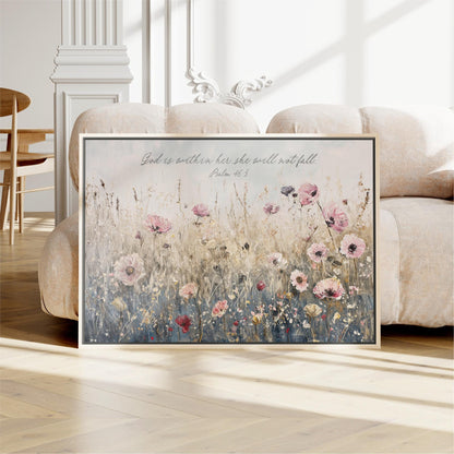 A framed painting of a field of flowers is displayed on a wooden floor in a room with a white sofa and a wooden chair.