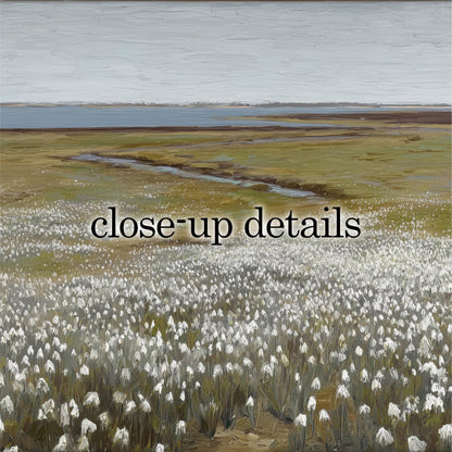 a vast field of white flowers, with a body of water visible in the distance.