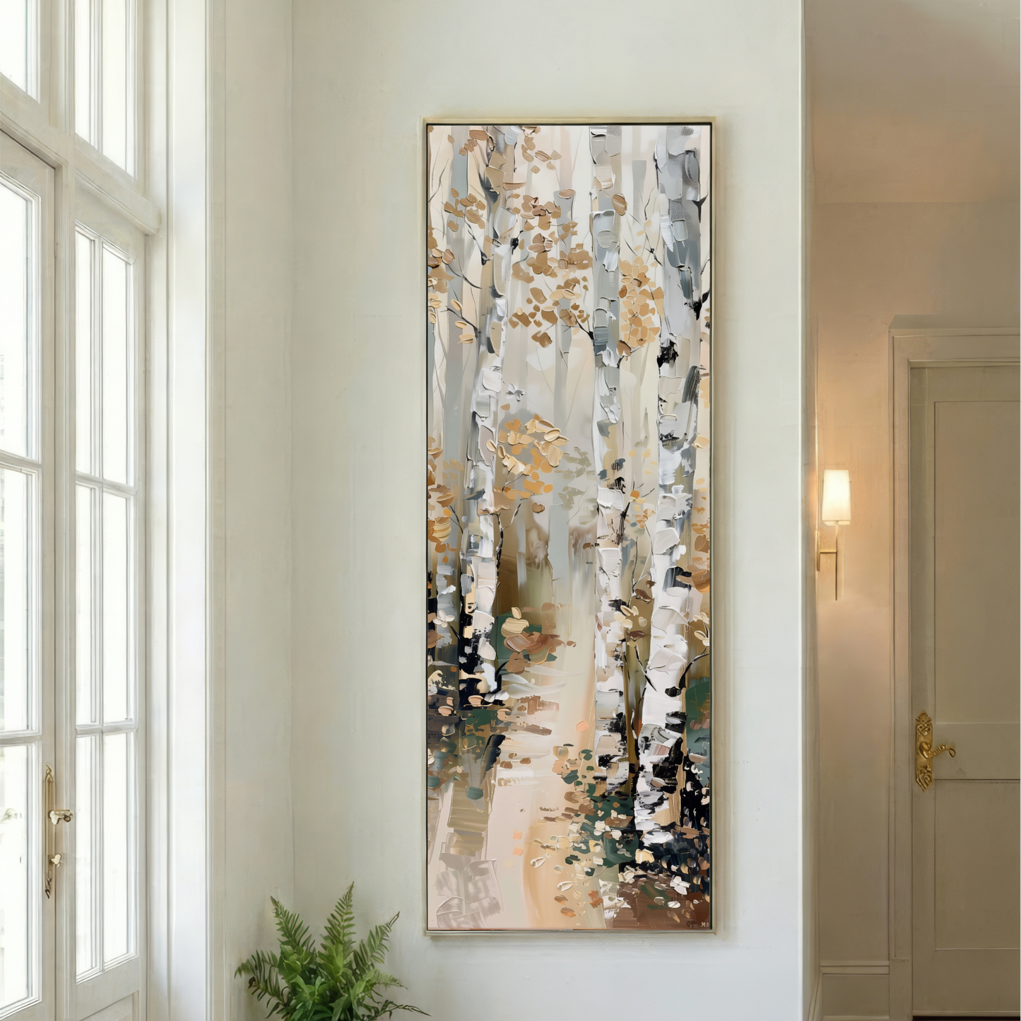 a large painting of a forest scene hanging on a white wall.