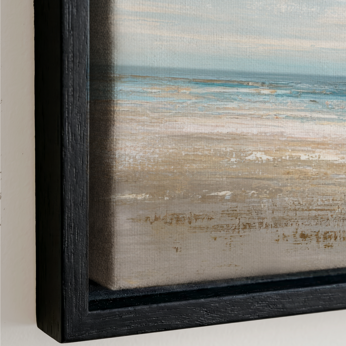 The image is a framed painting depicting a serene beach scene with a calm ocean and a sandy shore.