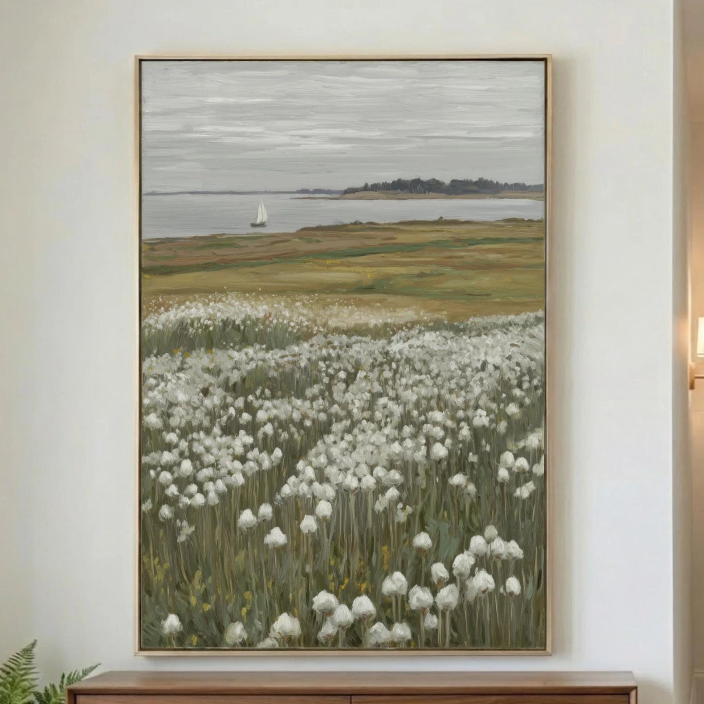 A quiet coastal landscape featuring a field of white wildflowers, calm water, and a lone sailboat in the distance. Soft neutral tones of sage green, cream, taupe, and gray create a relaxed, timeless look that works beautifully in coastal, cottage, farmhouse, and modern organic interiors.