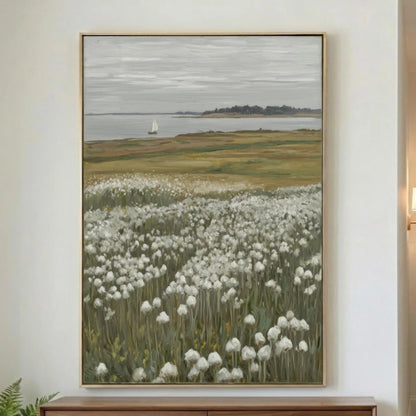 A quiet coastal landscape featuring a field of white wildflowers, calm water, and a lone sailboat in the distance. Soft neutral tones of sage green, cream, taupe, and gray create a relaxed, timeless look that works beautifully in coastal, cottage, farmhouse, and modern organic interiors.