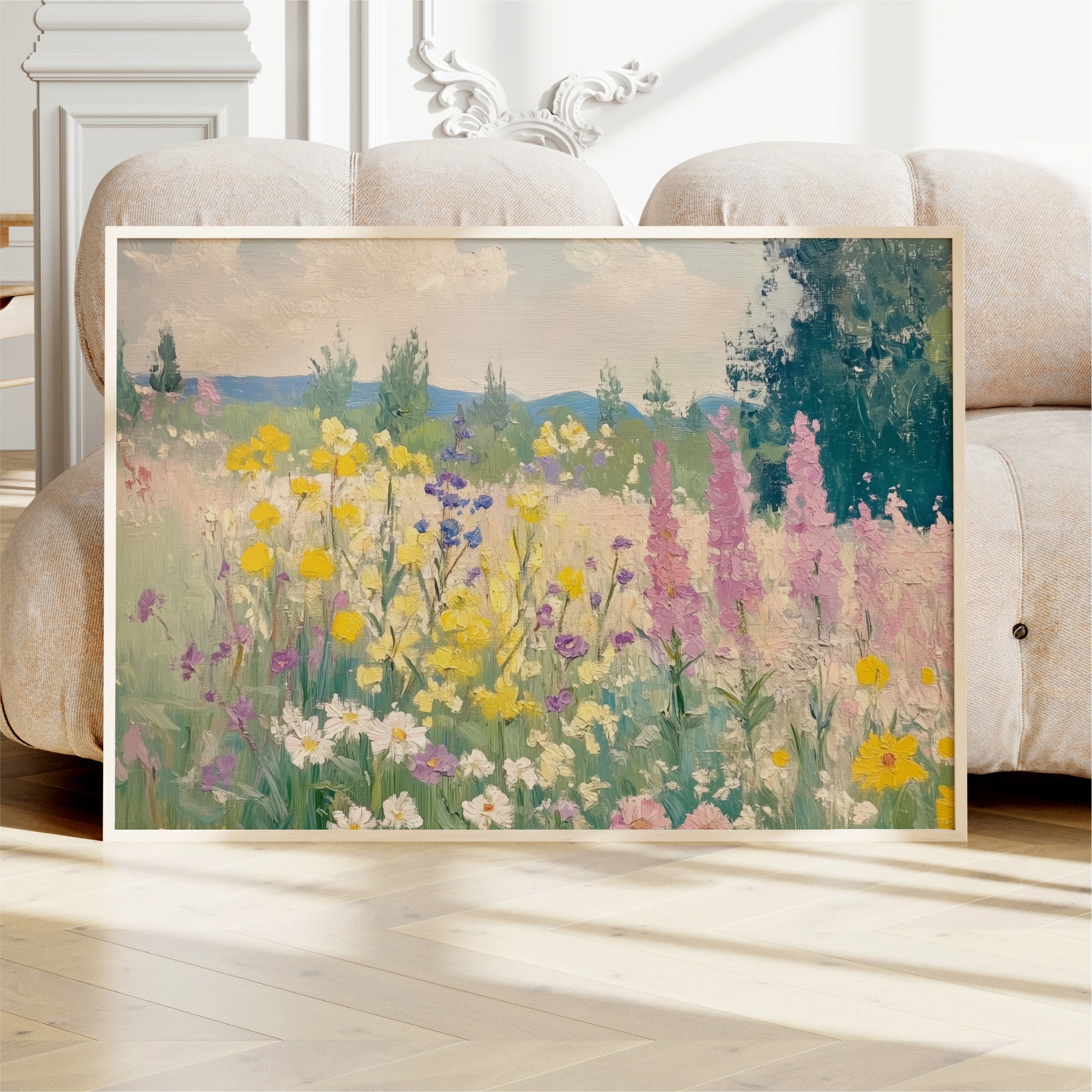 a large, framed painting of a colorful field of flowers, including yellow, pink, and purple blooms, set against a backdrop of trees and a blue sky.