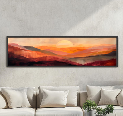 a large, rectangular painting of a sunset over mountains hanging on a wall above a couch.