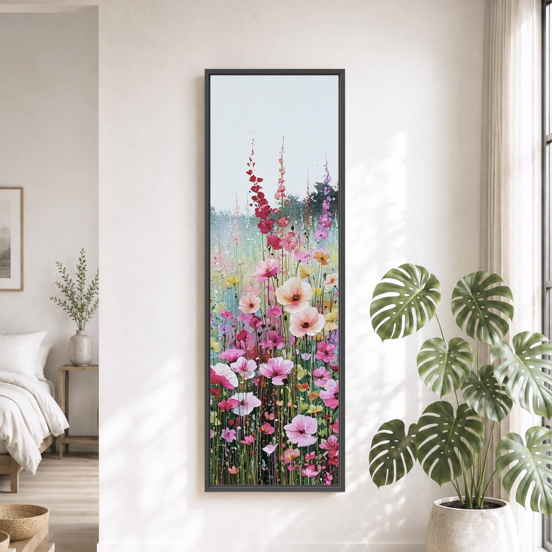 a serene and well-decorated living room with a large window, a bed, a potted plant, and a painting of a colorful flower field hanging on the wall.