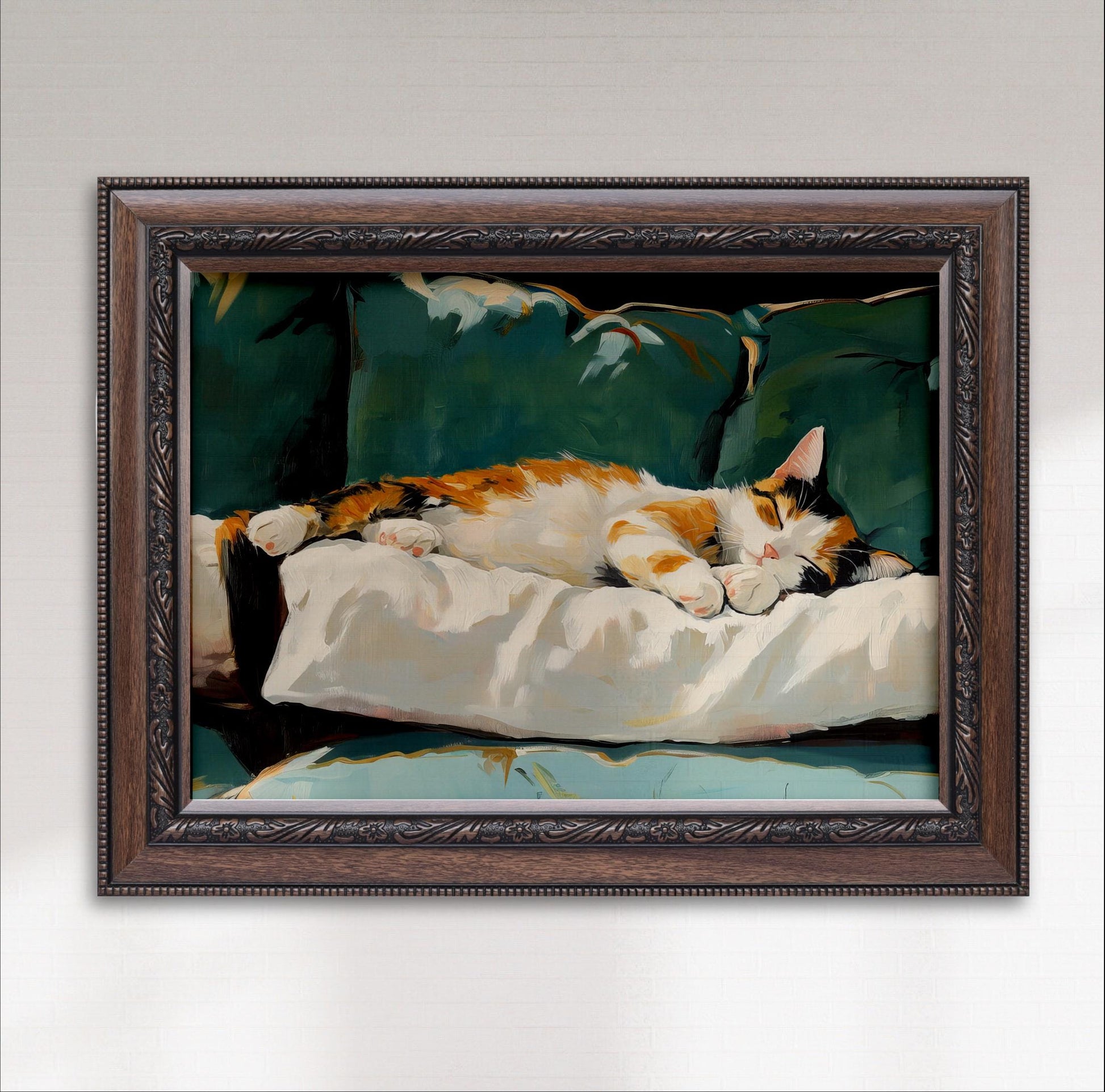 A framed painting depicting a cat sleeping on a white pillow on a green couch.