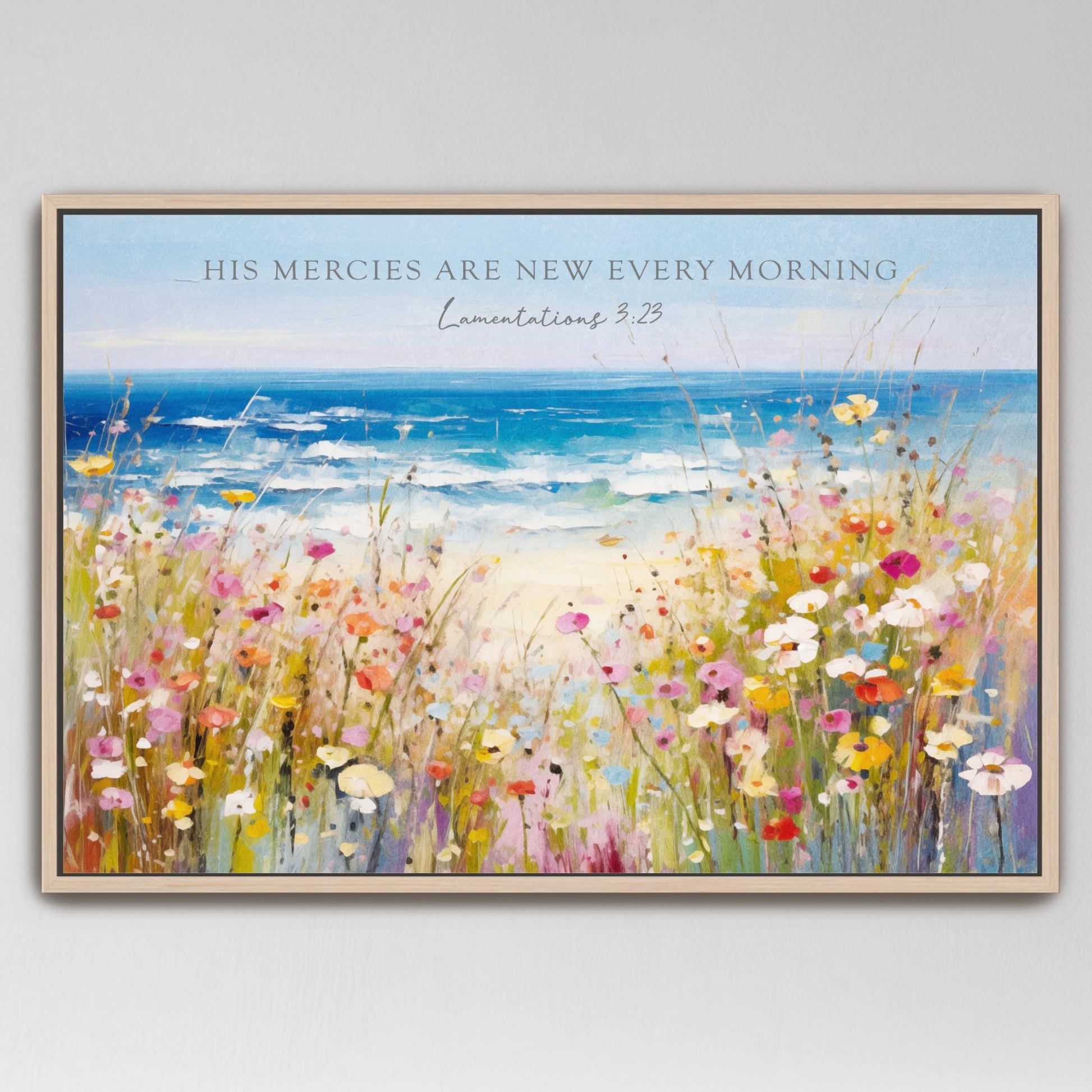 The image is a framed painting depicting a vibrant field of colorful wildflowers, with a serene ocean view in the background.