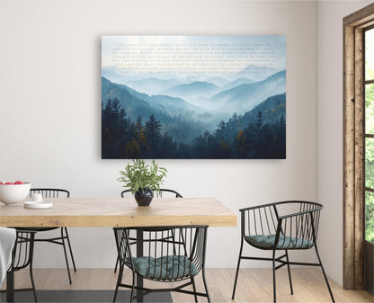 a serene dining area with a wooden table and chairs, a potted plant, and a large framed landscape painting depicting a mountain range.
